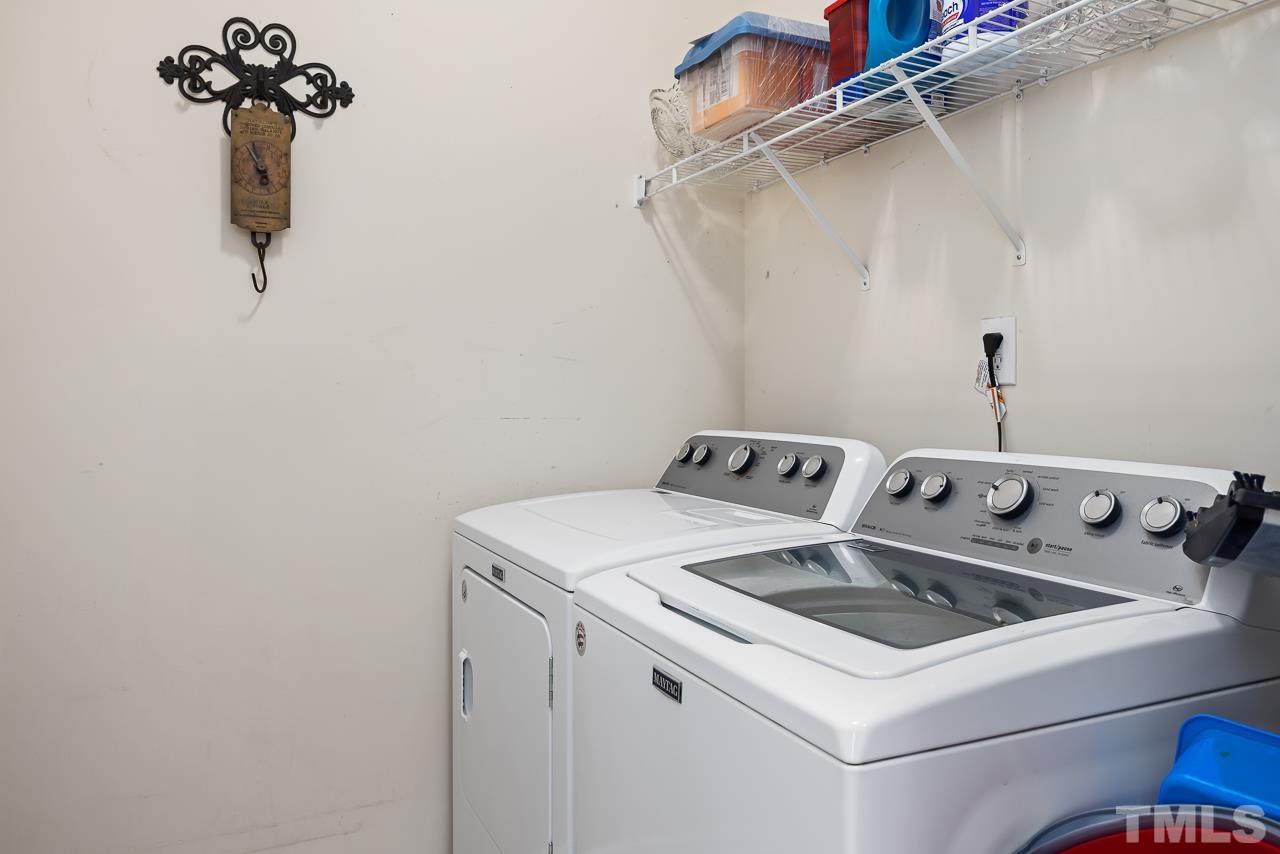 229 Roping Horn Way Willow Spring, NC 27592 - Photo 24 of 30 a utility room with dryer and washer