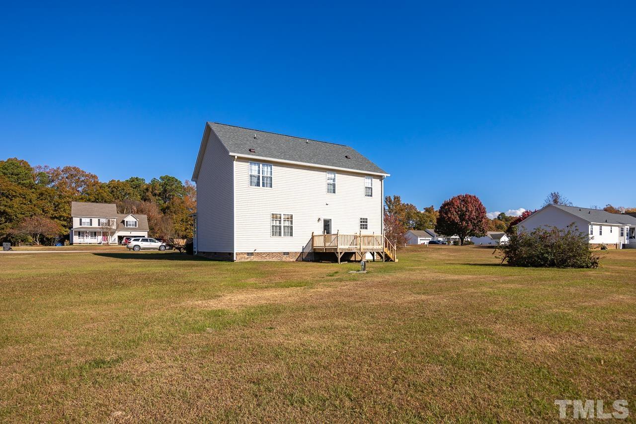 229 Roping Horn Way Willow Spring, NC 27592 - Photo 29 of 30 a view of a house with a yard