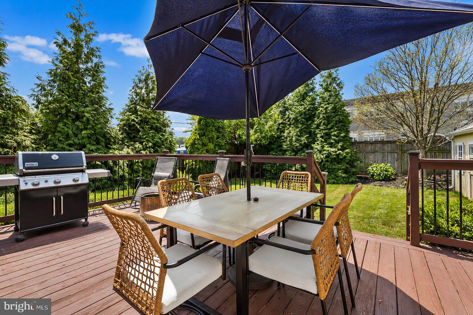 2404 Poplar Road Havertown, PA 19083 - Photo 8 of 40 a view of a patio with a table and chairs under an umbrella
