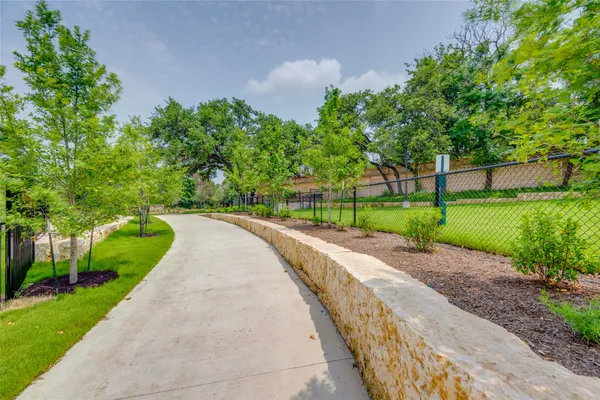 a view of a park with large trees