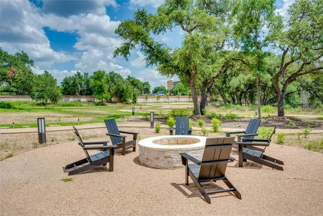 a view of a swimming pool and lounge chairs
