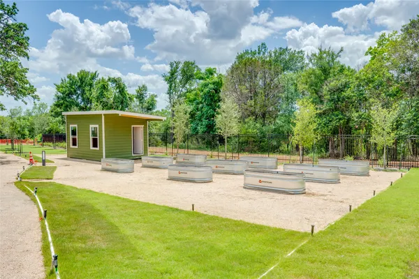 a view of a house with swimming pool and sitting area