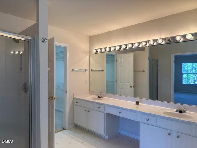 103 Rock River Road Morrisville, NC 27560 - Photo 12 of 18 a spacious bathroom with a double vanity sink and a mirror