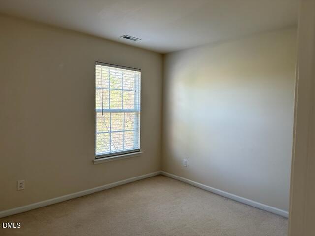 103 Rock River Road Morrisville, NC 27560 - Photo 13 of 18 an empty room with a window