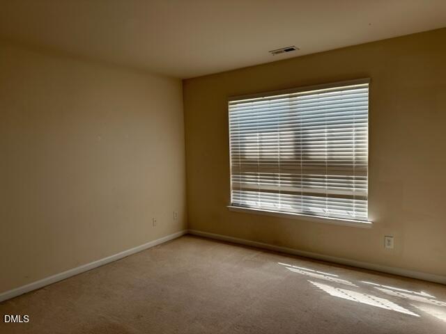 103 Rock River Road Morrisville, NC 27560 - Photo 14 of 18 a view of an empty room with a window