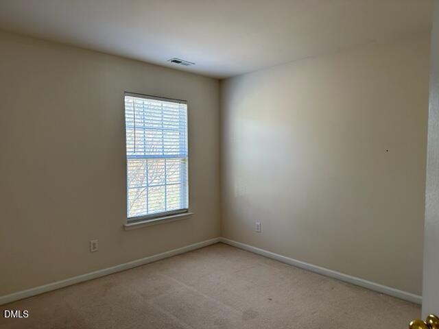 103 Rock River Road Morrisville, NC 27560 - Photo 15 of 18 an empty room with a window