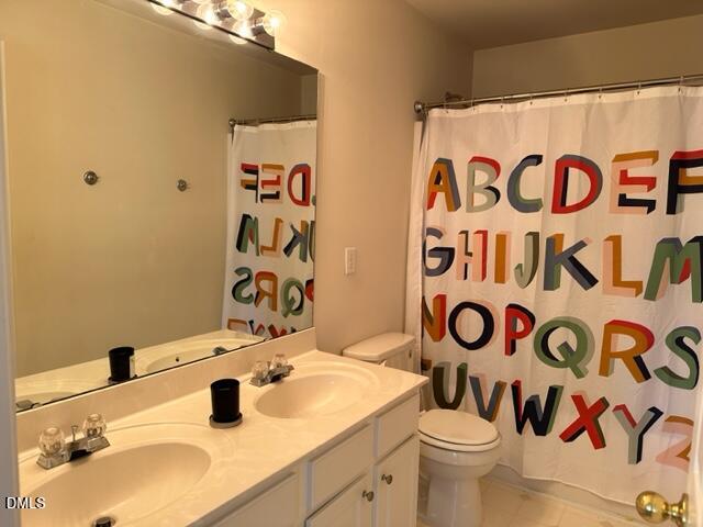 103 Rock River Road Morrisville, NC 27560 - Photo 16 of 18 a bathroom with a sink and a mirror