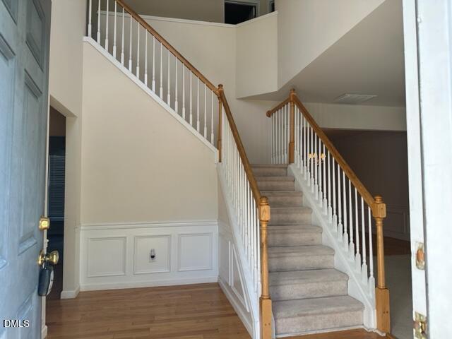 103 Rock River Road Morrisville, NC 27560 - Photo 4 of 18 a view of staircase with wooden floor and staircase