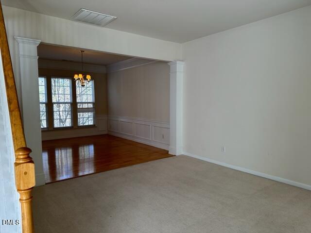 103 Rock River Road Morrisville, NC 27560 - Photo 5 of 18 an empty room with wooden floor and windows