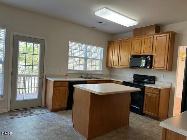 103 Rock River Road Morrisville, NC 27560 - Photo 6 of 18 a kitchen with stainless steel appliances granite countertop a stove a sink and a microwave
