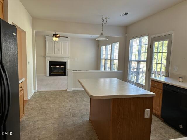 103 Rock River Road Morrisville, NC 27560 - Photo 8 of 18 a kitchen with stainless steel appliances granite countertop a sink a microwave a refrigerator and a stove