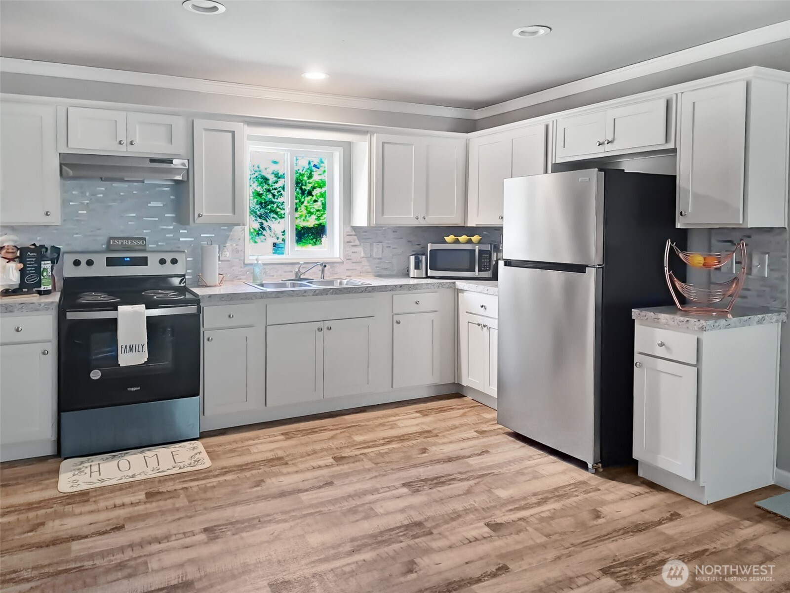 6236 Azure Way Maple Falls, WA 98266 - Photo 4 of 14 a kitchen with a refrigerator sink and wooden cabinets
