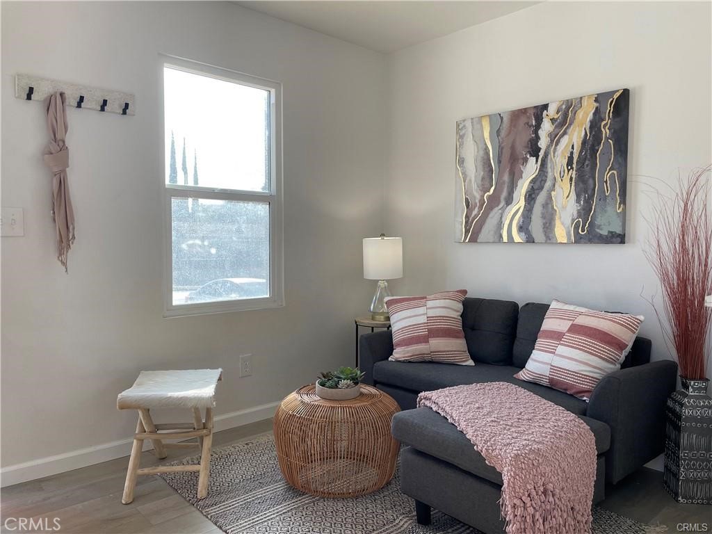 10098 Campbell Avenue, Unit 4 Riverside, CA 92503 - Photo 14 of 17 a living room with furniture and a window