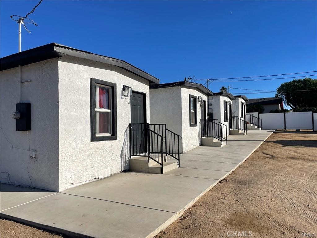 10098 Campbell Avenue, Unit 4 Riverside, CA 92503 - Photo 2 of 17 a view of a house with a backyard