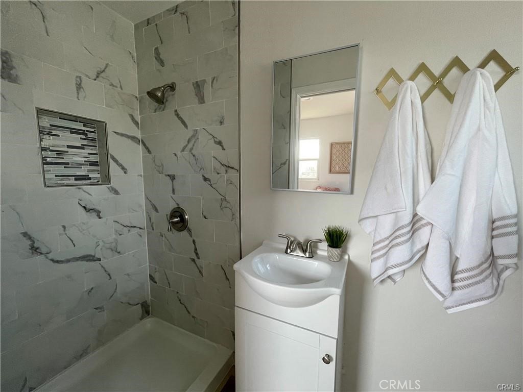 10098 Campbell Avenue, Unit 4 Riverside, CA 92503 - Photo 8 of 17 a bathroom with a sink a toilet and shower