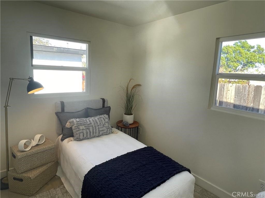 10098 Campbell Avenue, Unit 4 Riverside, CA 92503 - Photo 10 of 17 a bedroom with a bed and a window