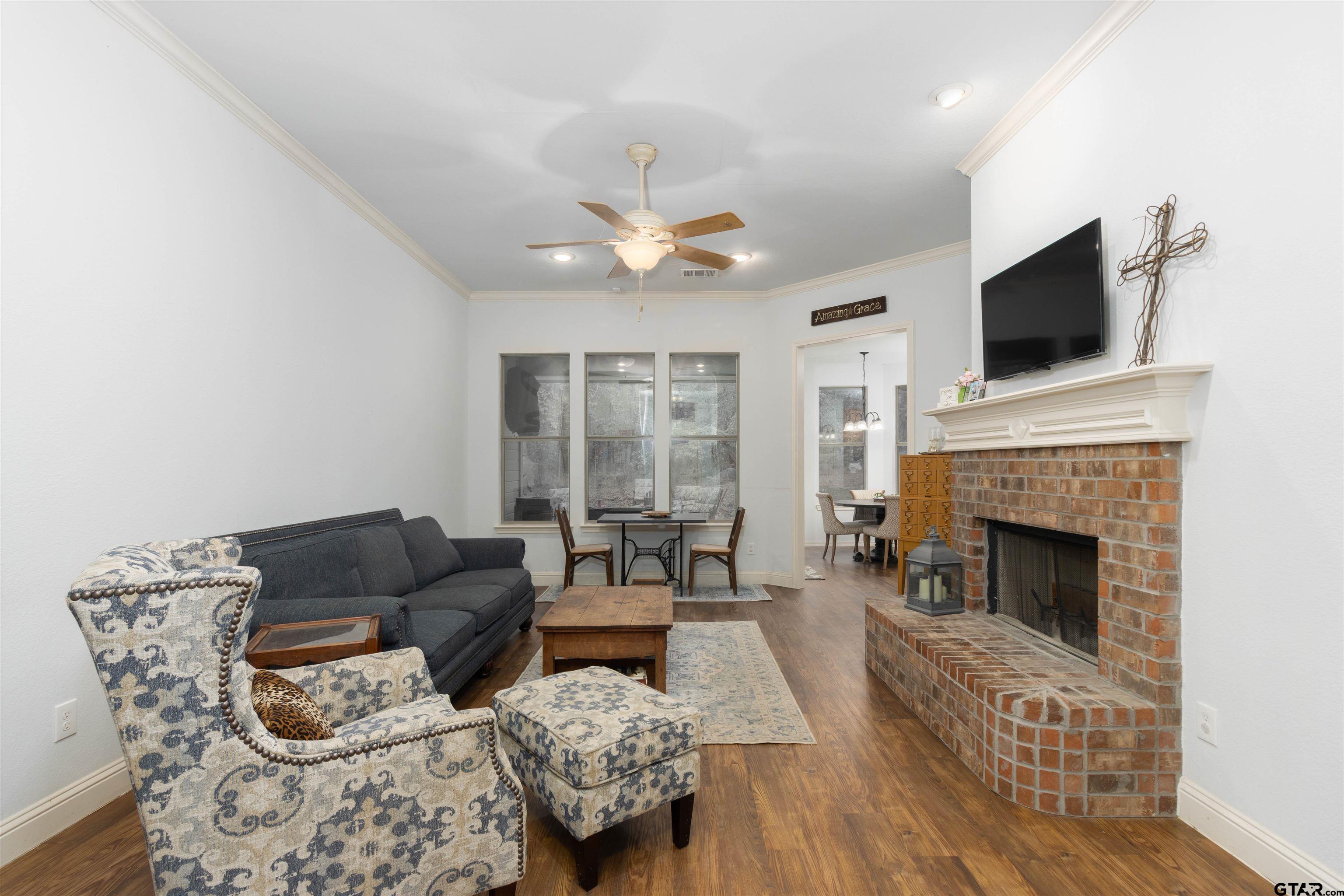 18424 Walnut Circle Flint, TX 75762 - Photo 3 of 26 a living room with furniture fireplace and flat screen tv