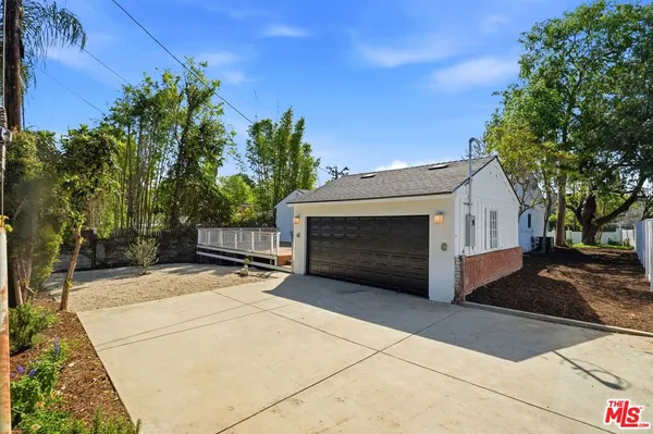 a view of outdoor space garage and fire pit