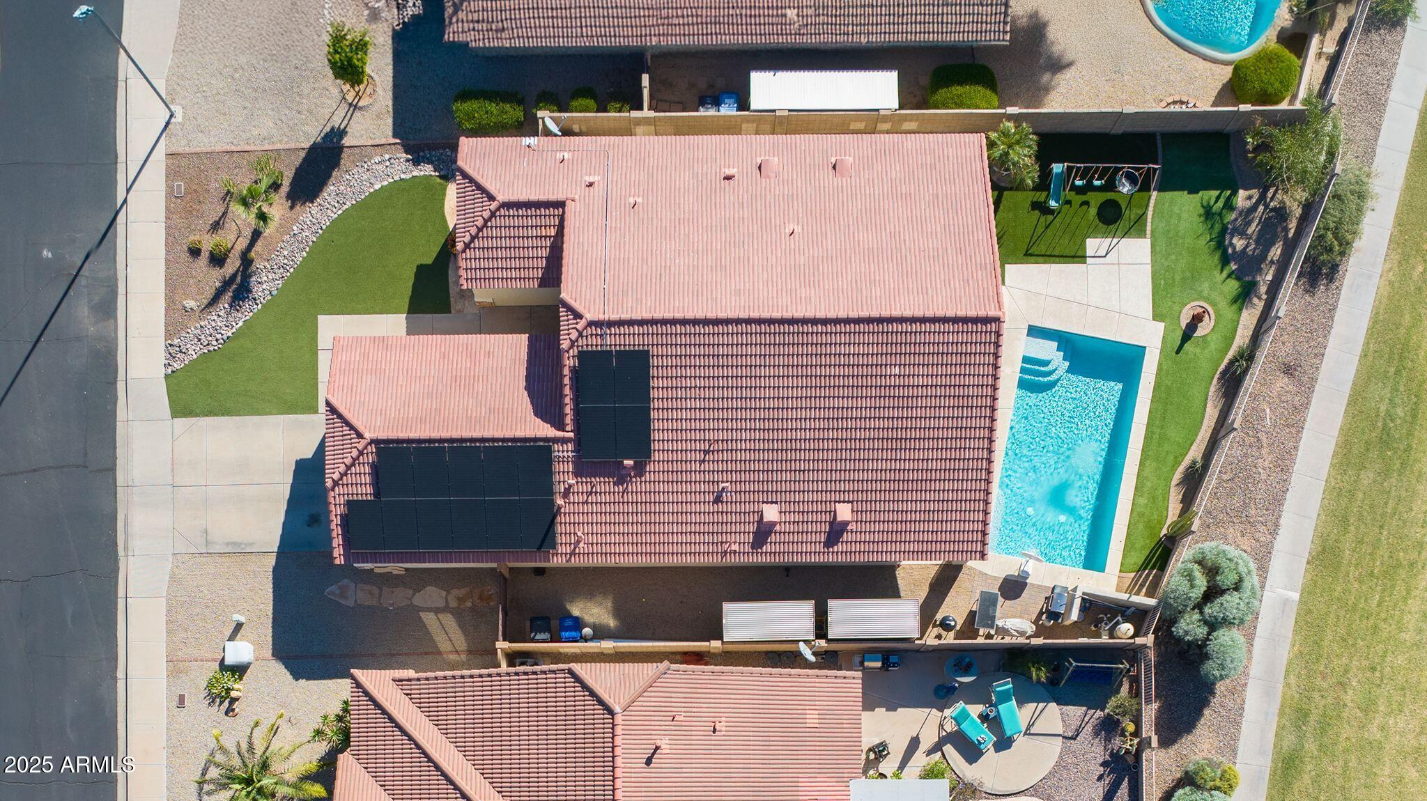 an aerial view of houses with outdoor space