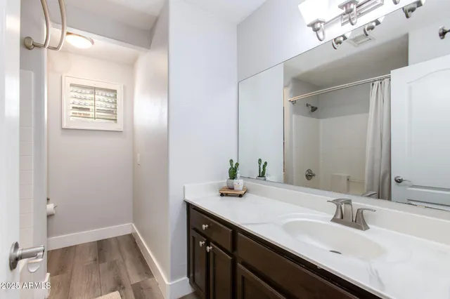 a bathroom with a bathtub and window