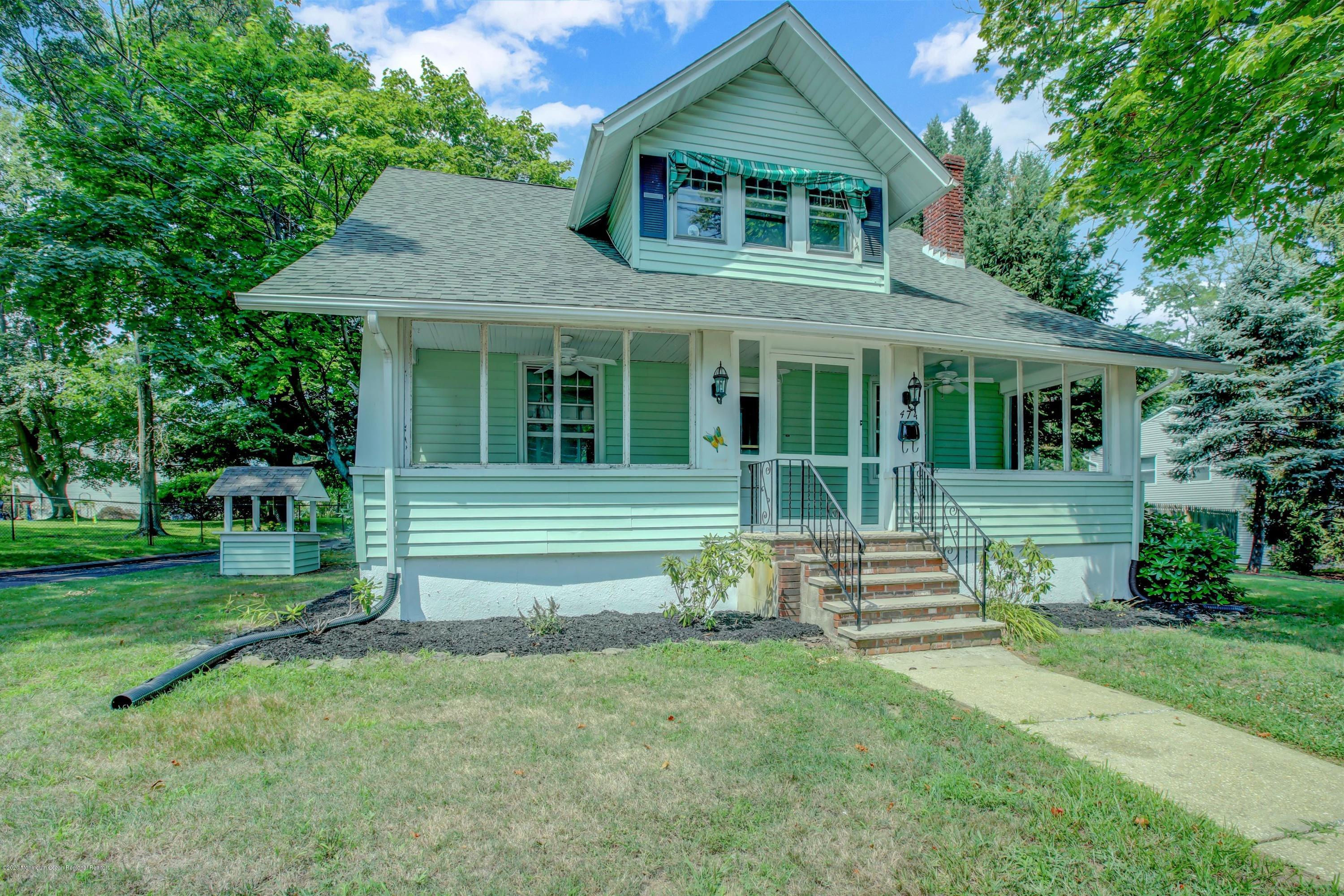 474 E Road Belford, NJ 07718 - Photo 1 of 32 a front view of a house with a garden
