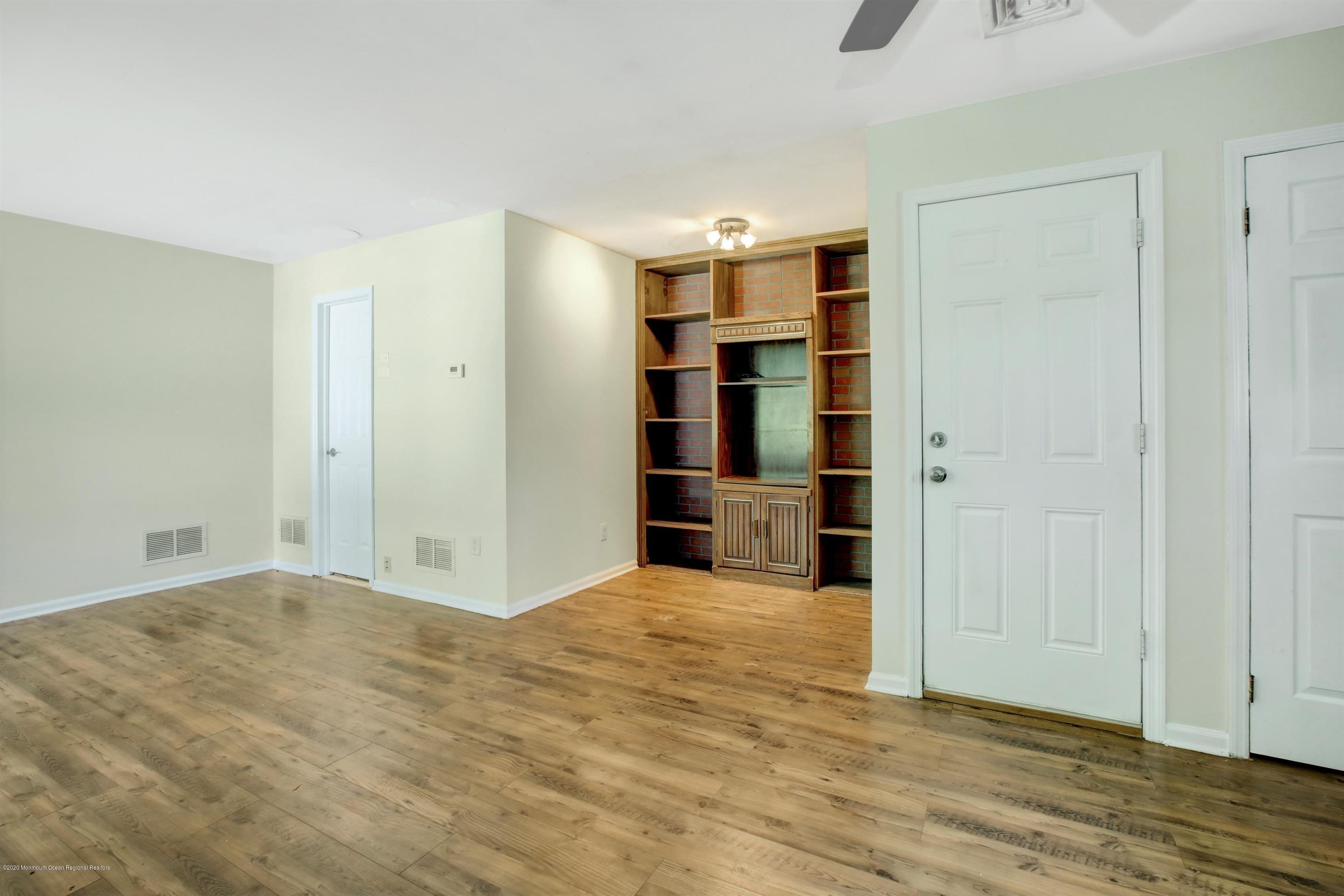 474 E Road Belford, NJ 07718 - Photo 15 of 32 a view of empty room with wooden floor and closet