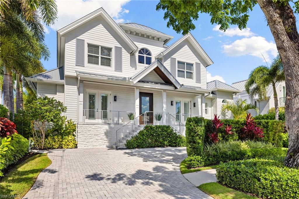 950 8th Street South Naples, FL 34102 - Photo 19 of 21 a front view of a house with a yard