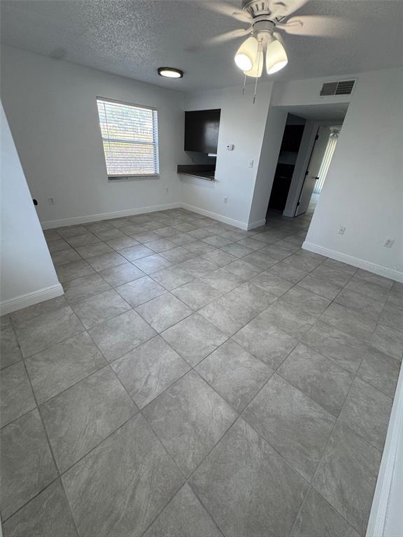 1195 Bentley Road, Unit 1 Leesburg, FL 34748 - Photo 4 of 13 wooden floor in an empty room with a window