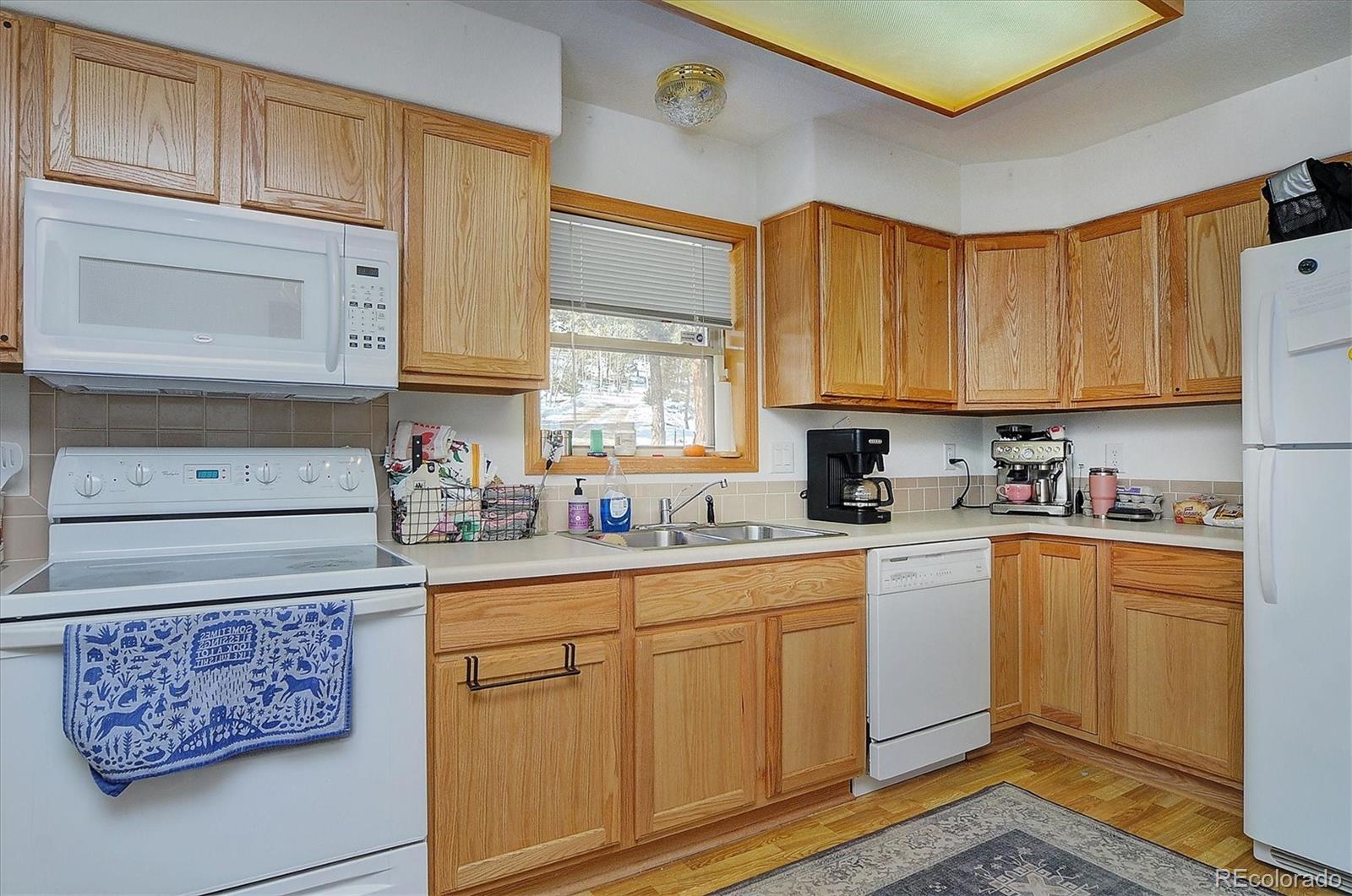 1733 Blacksmith Road Hartsel, CO 80449 - Photo 11 of 22 a kitchen with stainless steel appliances granite countertop a sink and cabinets