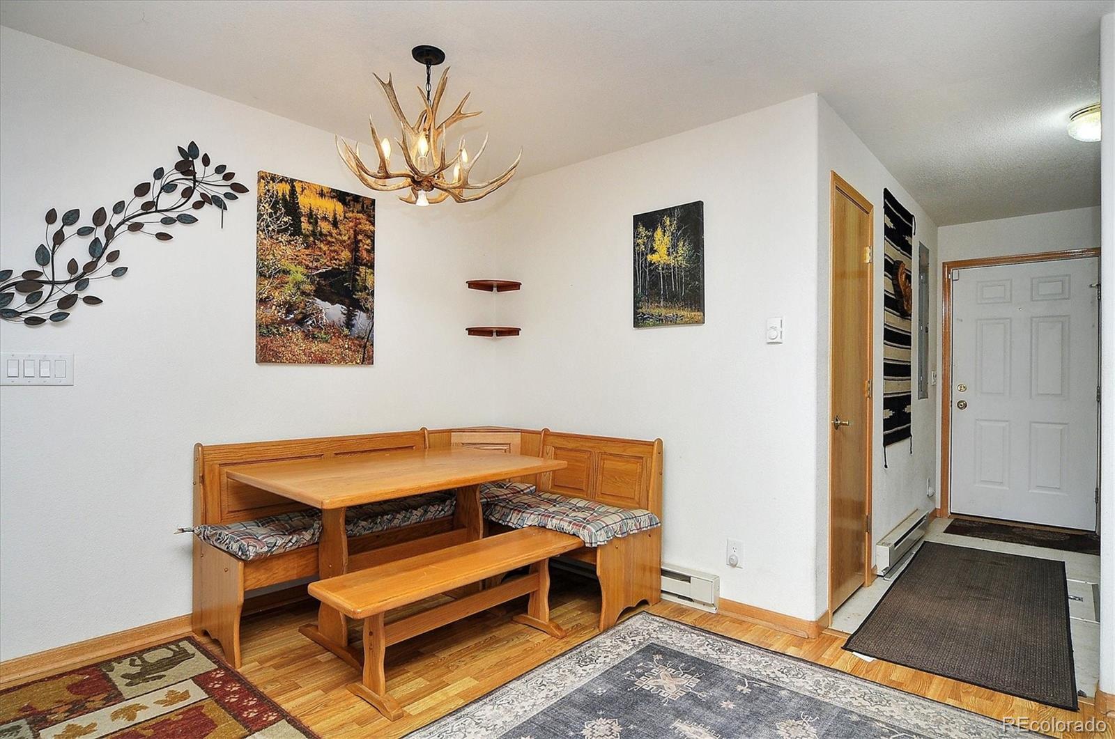 1733 Blacksmith Road Hartsel, CO 80449 - Photo 14 of 22 a room with chandelier fan and wooden floor