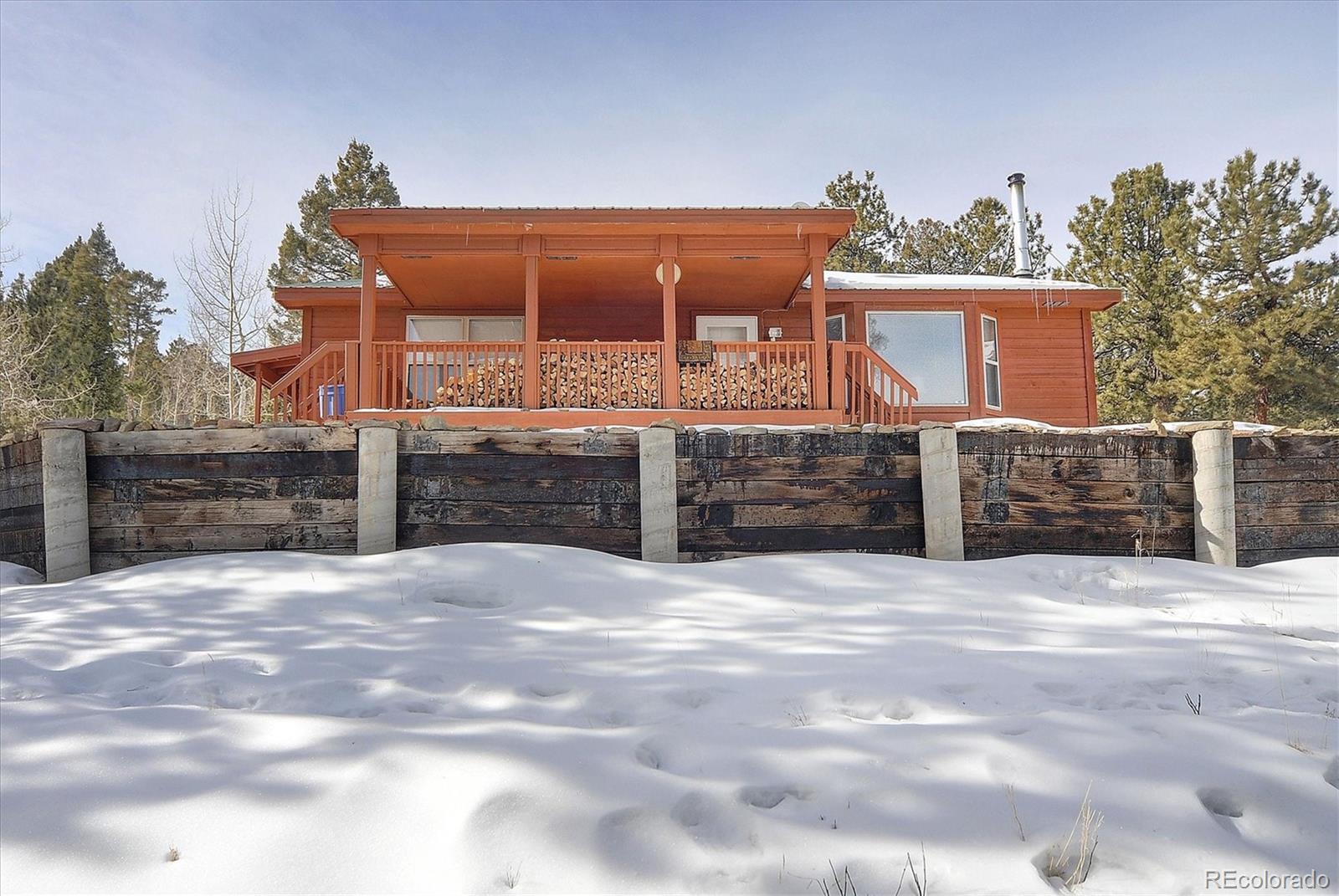 1733 Blacksmith Road Hartsel, CO 80449 - Photo 20 of 22 a view of a house with a snow in the background