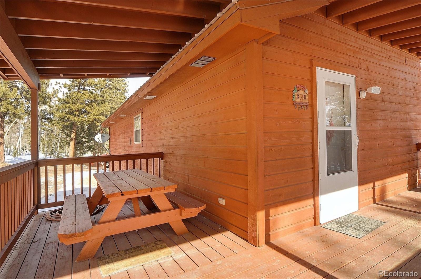1733 Blacksmith Road Hartsel, CO 80449 - Photo 2 of 22 a view of a balcony with chairs