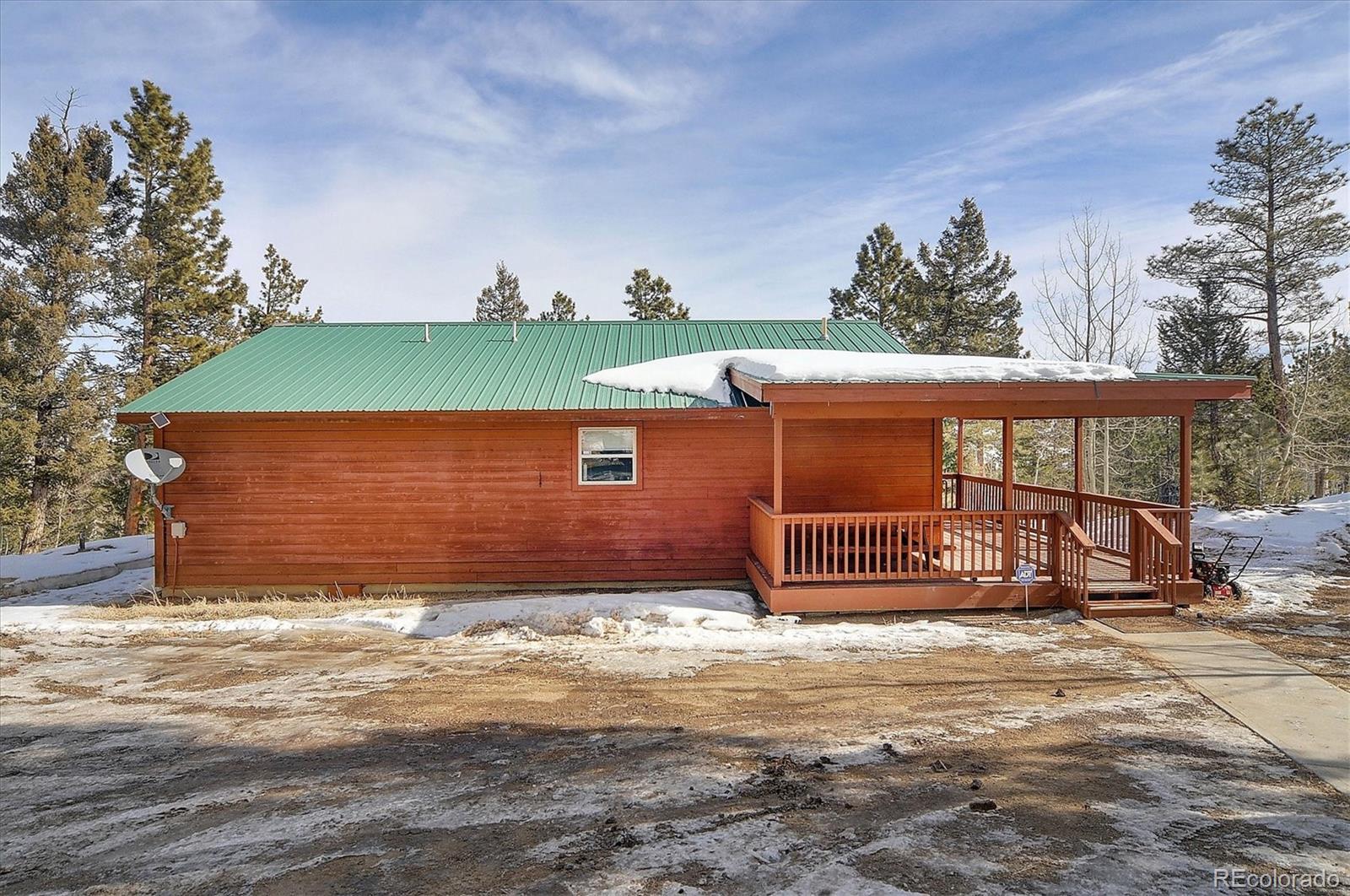 1733 Blacksmith Road Hartsel, CO 80449 - Photo 21 of 22 a front view of a house with a yard