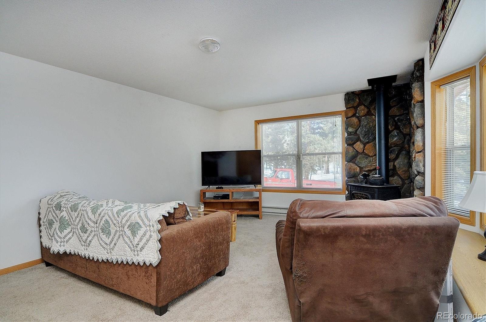 1733 Blacksmith Road Hartsel, CO 80449 - Photo 8 of 22 a living room with furniture and a flat screen tv