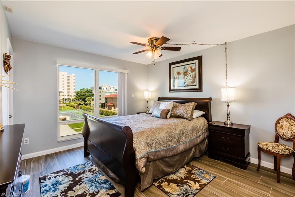 921 Seagrape Drive, Unit 308B Marco Island, FL 34145 - Photo 11 of 19 Bedroom featuring ceiling fan and light hardwood / wood-style floors