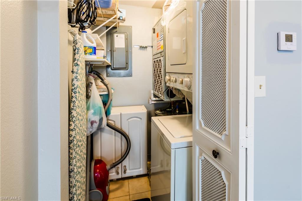 921 Seagrape Drive, Unit 308B Marco Island, FL 34145 - Photo 18 of 19 a utility room with dryer and washer