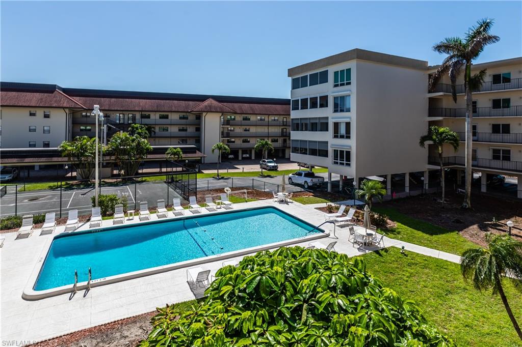 921 Seagrape Drive, Unit 308B Marco Island, FL 34145 - Photo 2 of 19 View of pool featuring a patio area