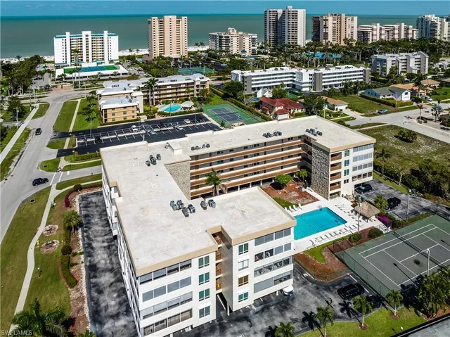 a bathroom with a shower toilet and sink