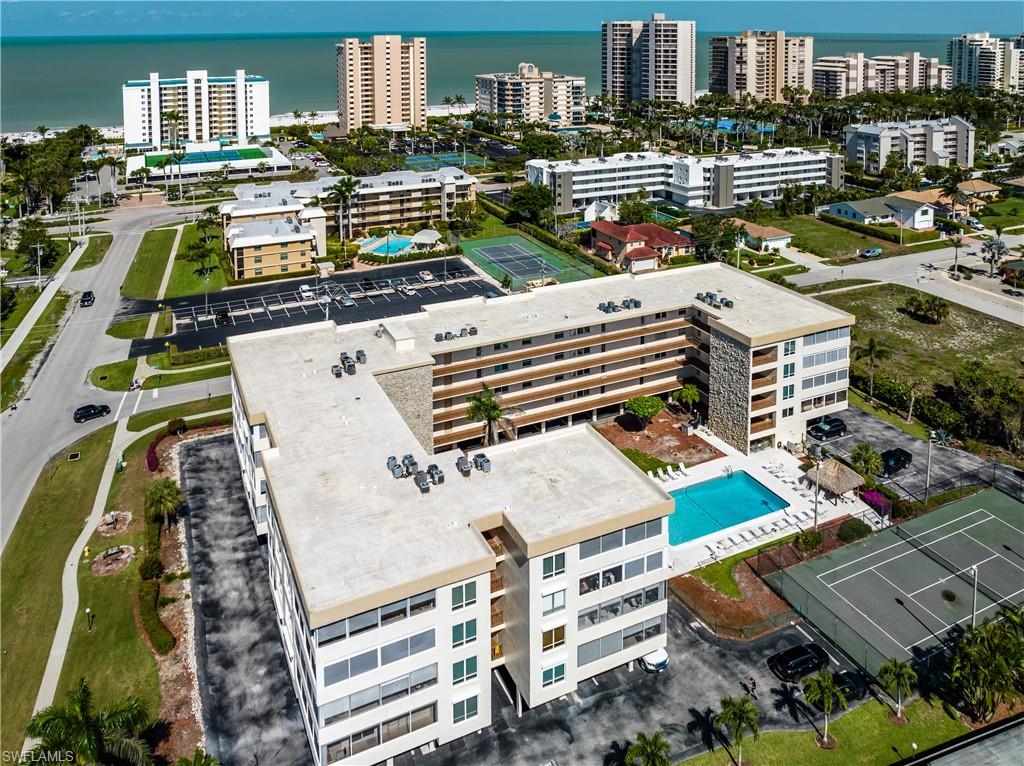 921 Seagrape Drive, Unit 308B Marco Island, FL 34145 - Photo 4 of 19 Birds eye view of property with a water view