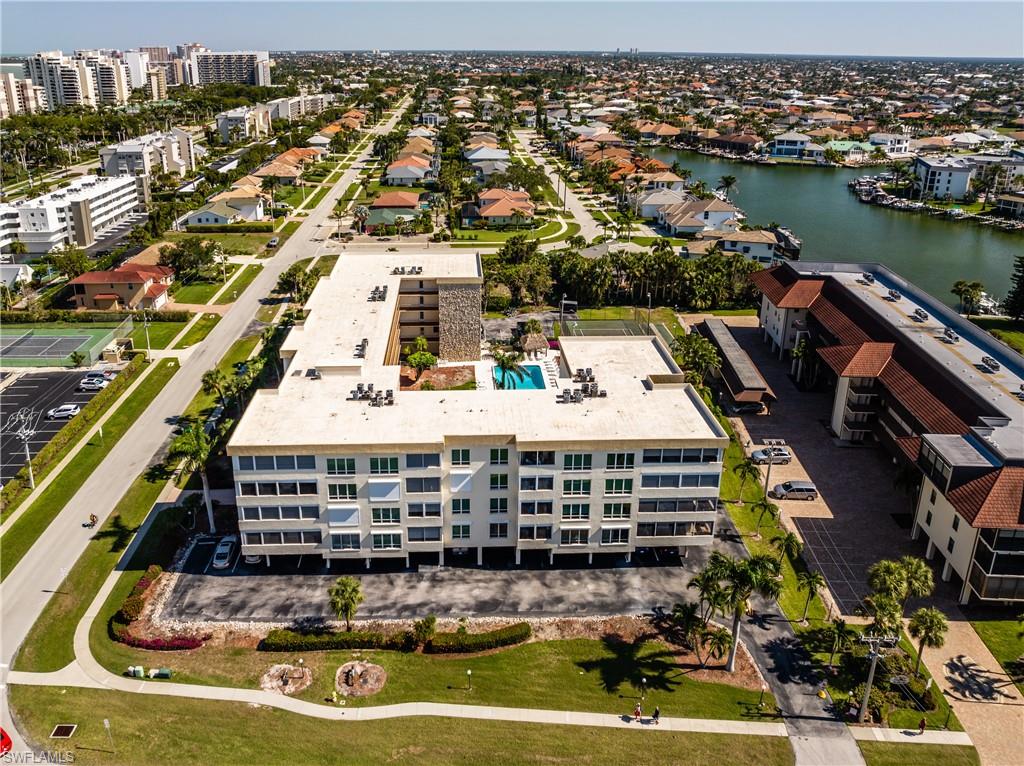 921 Seagrape Drive, Unit 308B Marco Island, FL 34145 - Photo 6 of 19 Drone / aerial view with a water view