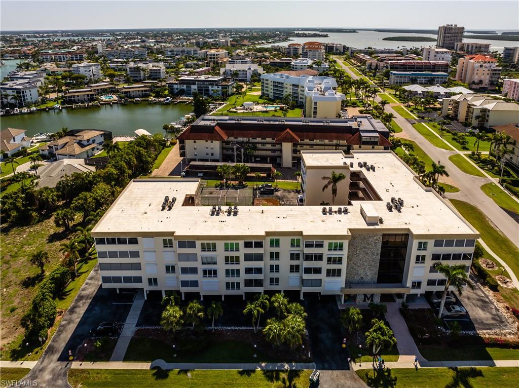 921 Seagrape Drive, Unit 308B Marco Island, FL 34145 - Photo 8 of 19 Bird's eye view with a water view
