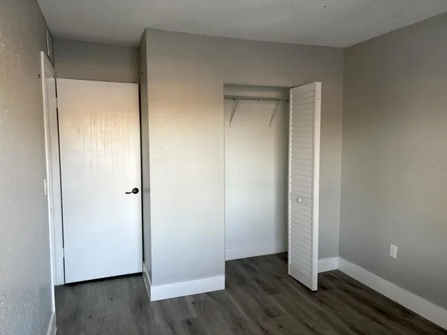 a white toilet sitting next to a bath tub