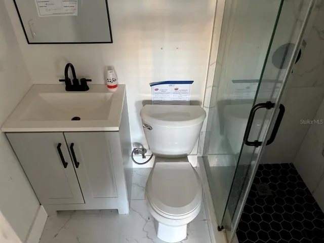 a bathroom with a sink and shower