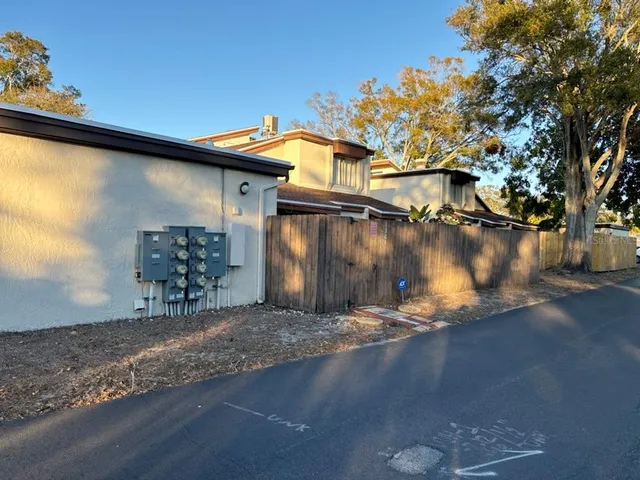 a backyard of a house with wooden floor and lake view