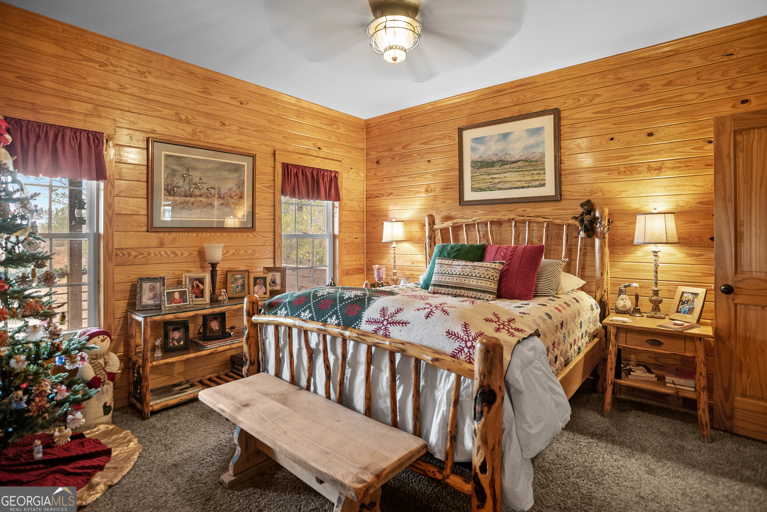 418 Oglesby Pond Road Portal, GA 30450 - Photo 12 of 56 a bedroom with a bed and a chandelier