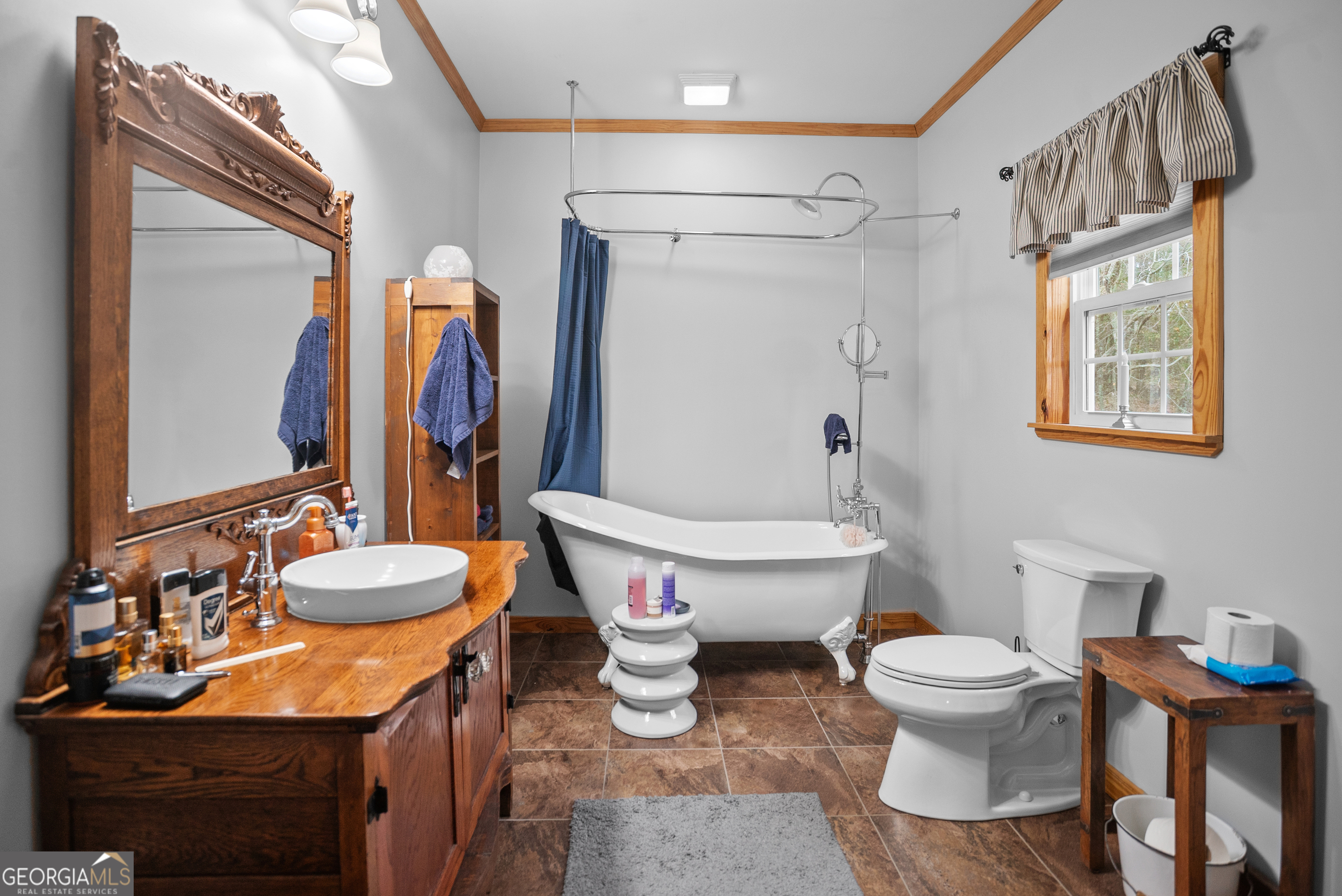 418 Oglesby Pond Road Portal, GA 30450 - Photo 17 of 56 a bathroom with a sink toilet and shower