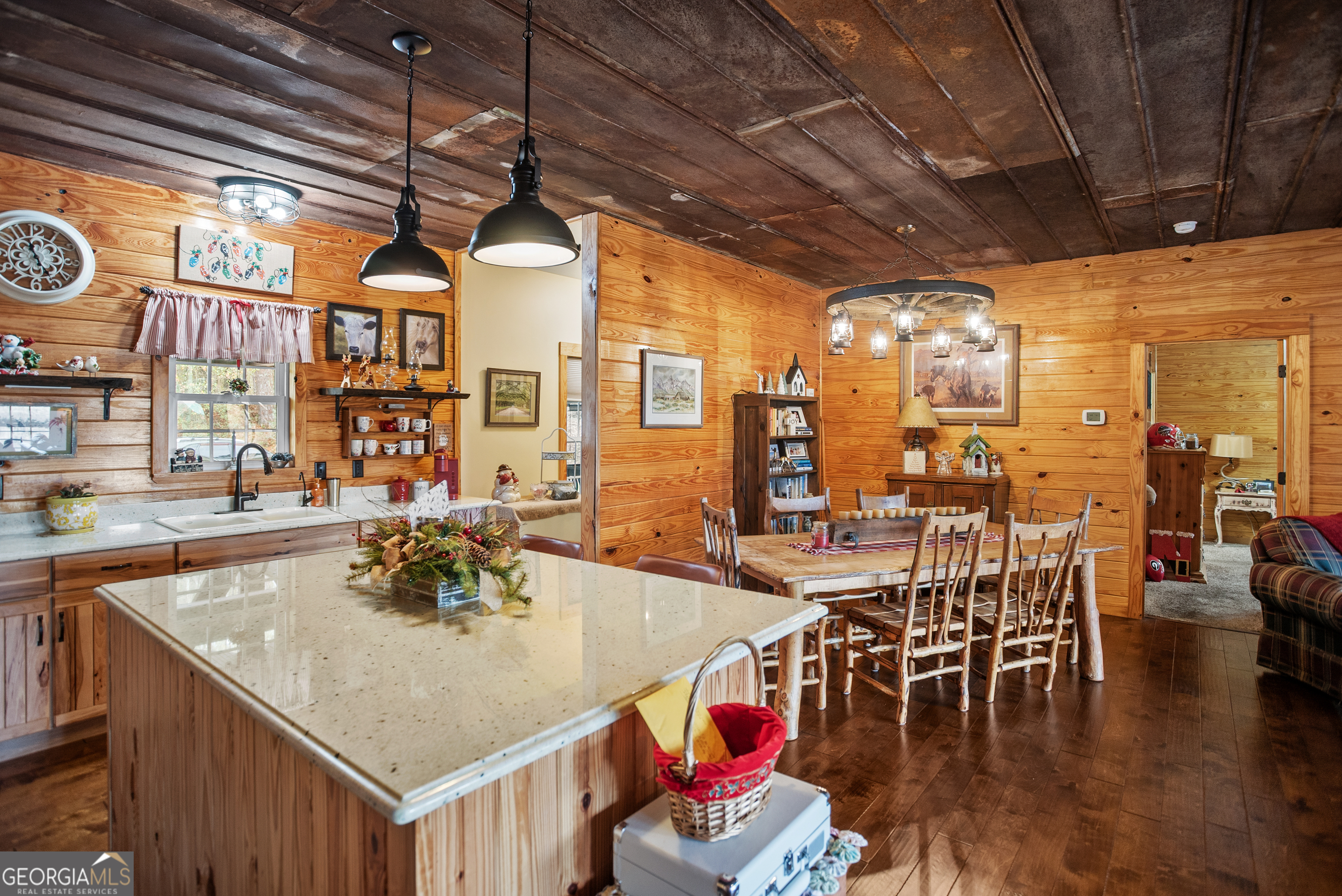 418 Oglesby Pond Road Portal, GA 30450 - Photo 26 of 56 a kitchen with a table chairs and a chandelier