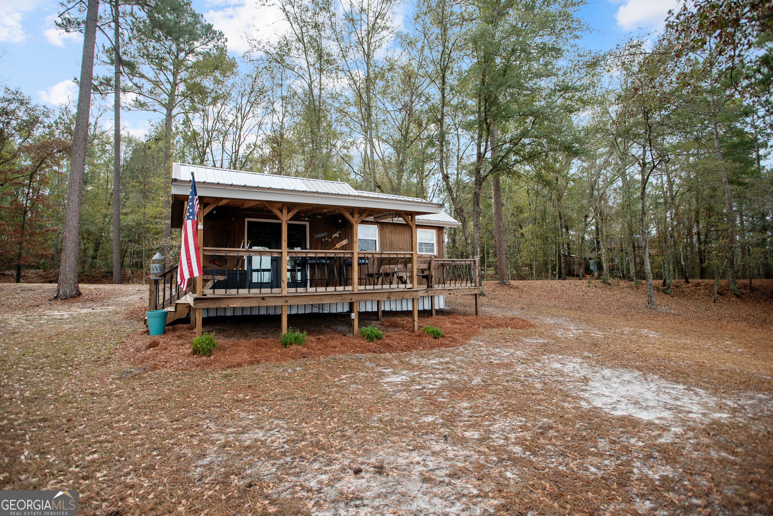 418 Oglesby Pond Road Portal, GA 30450 - Photo 27 of 56 a view of backyard with deck and outdoor seating