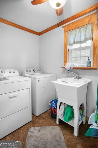 a view of a two chairs in the yard