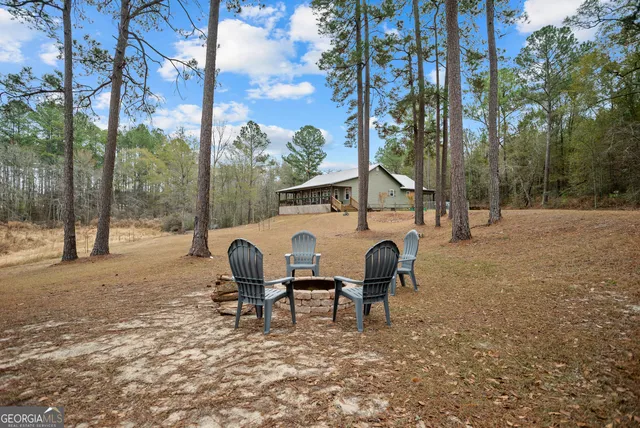 a bed room with a bed and a chair